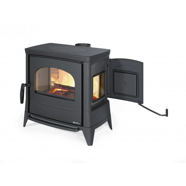 Black wood stove with open door on a white background