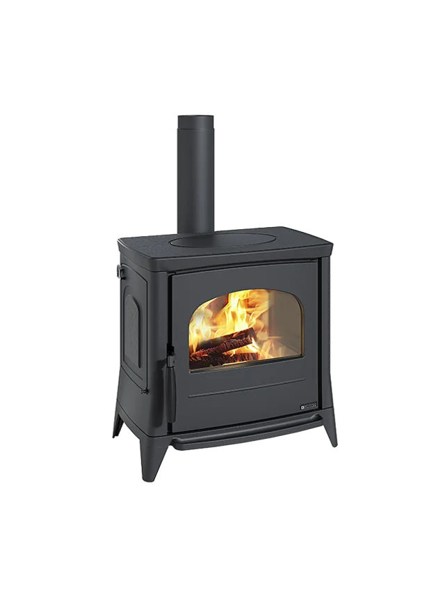 Black wood stove with visible flames on a white background