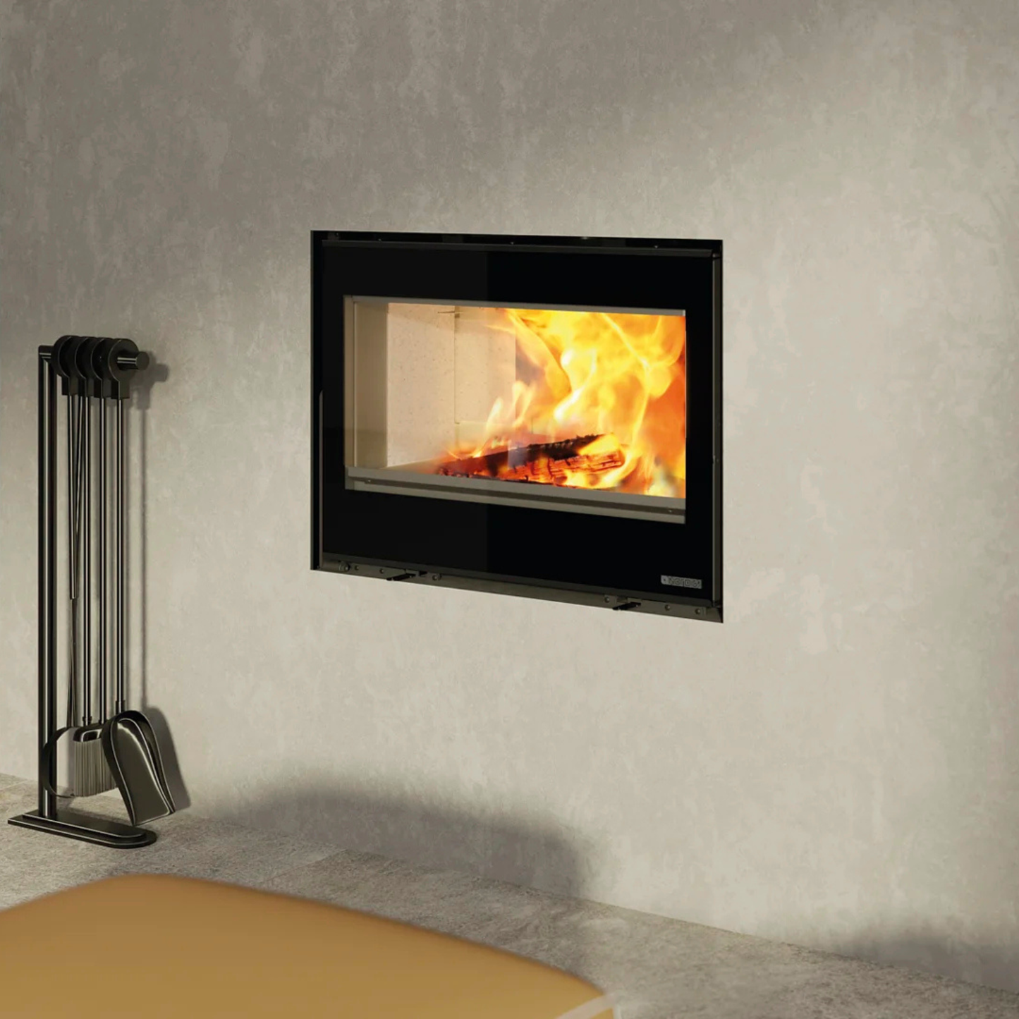 Wall-mounted fireplace with burning logs and a set of metal tools on a gray wall.