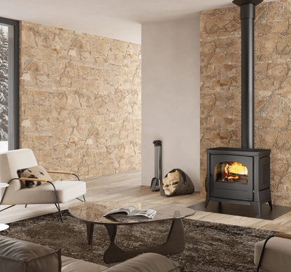 Modern living room with stone walls, a fireplace, and minimal decor.