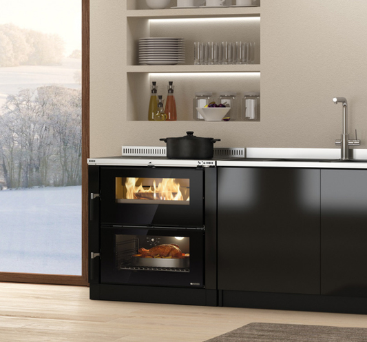 Modern kitchen with black oven and stove, snow outside