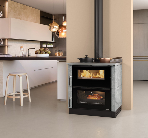 Modern kitchen with a freestanding fireplace and stove.